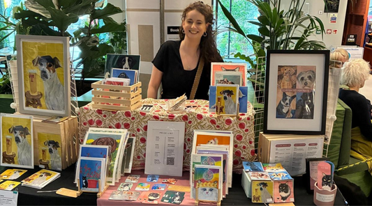 Hannah Kelly at The Social Hub Glasgow art market with a display of custom pet portraits