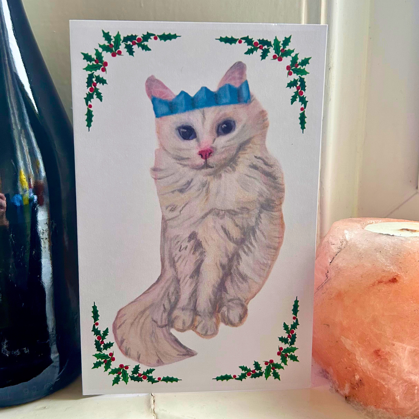 Long-haired white cat with Christmas cracker hat card